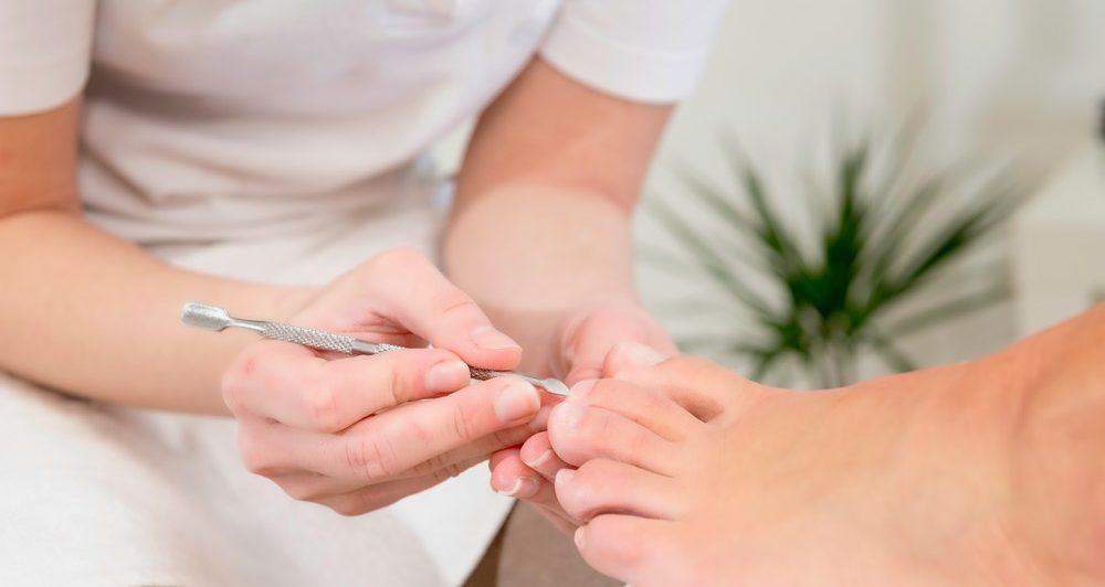 Pedicure procedure in nail salon